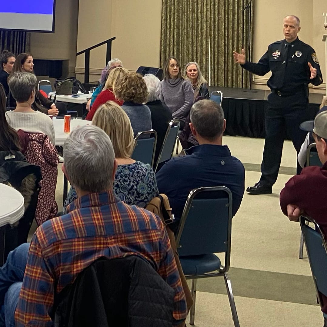 Colonel Christ Moffatt, chief commander of the MPD Appling Farms Station, addresses the group
